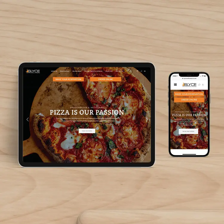A laptop and mobile phone showing our delicious descriptions and appetizing imagery for SLYCE's website.