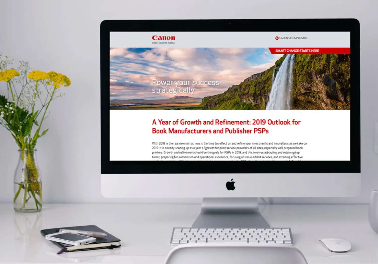 A desktop computer showing the Canon Solutions America website