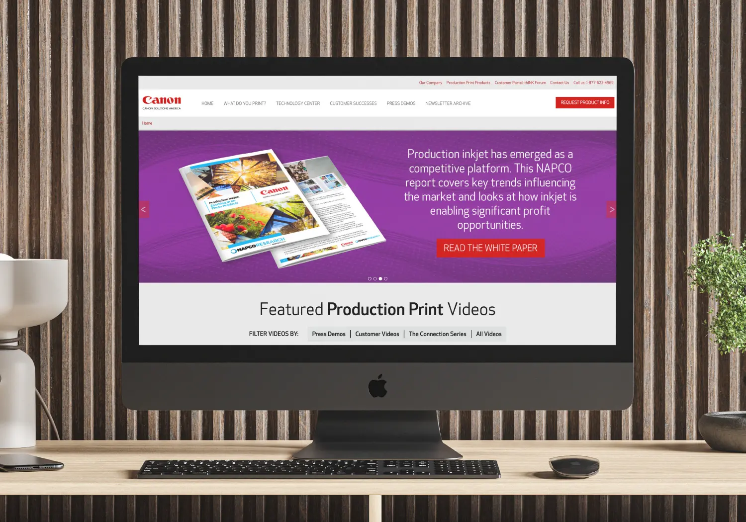 Desktop monitor displaying the Canon Solutions America online resource center we built and maintain.