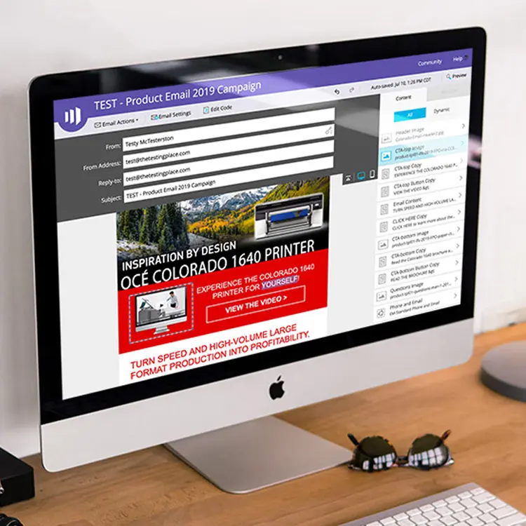 computer on desk, screen shows a test email campaign